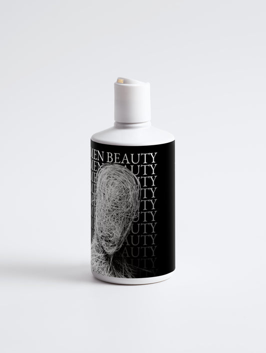 White bottle with black label featuring an abstract design on a white, background, Volumize Shampoo.