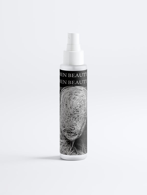 Skincare bottle with label featuring hair strands on a white background, Keratin Hair Mist.