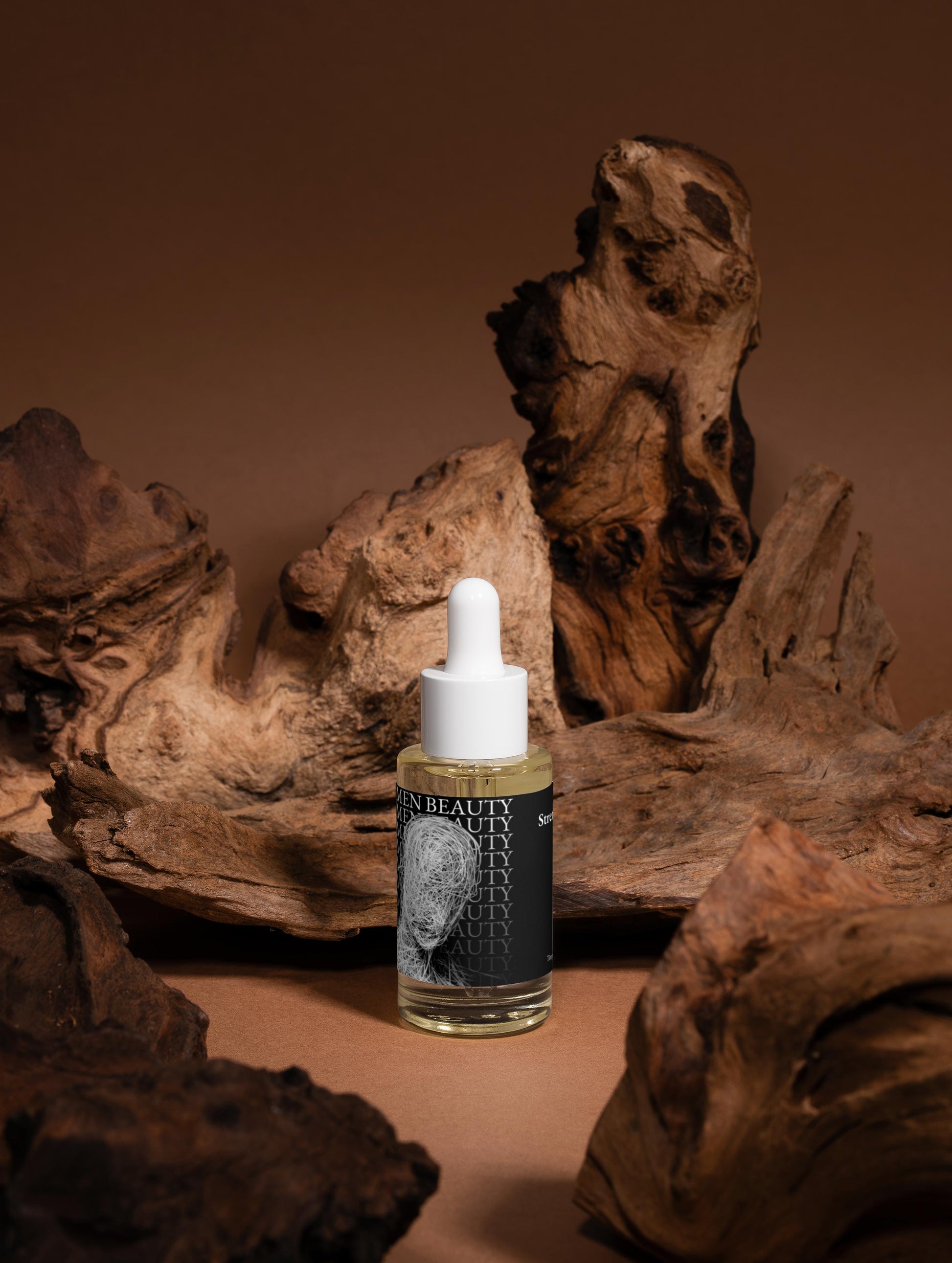 Skincare bottle with dropper on a brown background with natural wood elements, Scalp Oil.