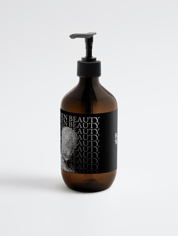 Brown bottle with black pump and label on a white background, Body Wash