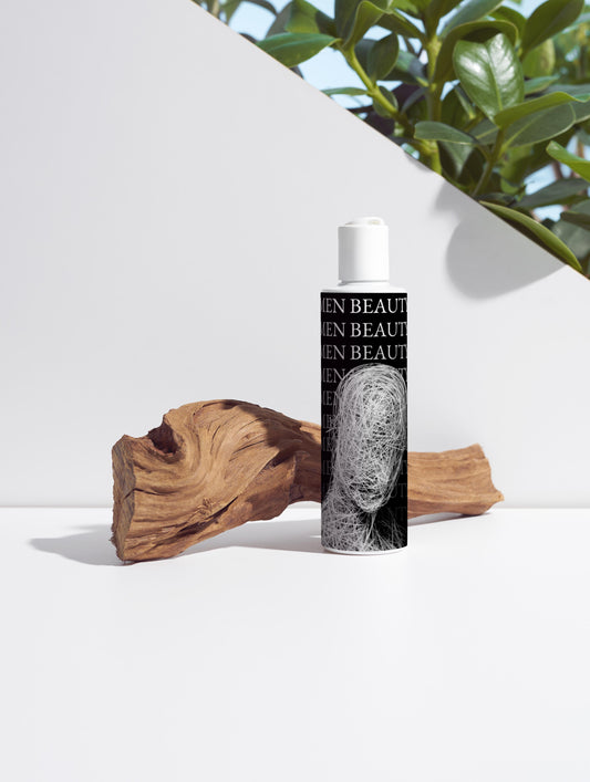 Skincare bottle with brand name on a white surface with natural elements, Hydrating Toner.