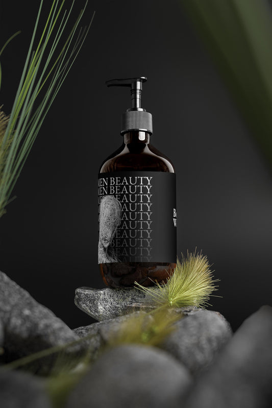 Bottle of 'Men Beauty' product on a dark background with greenery, body wash.