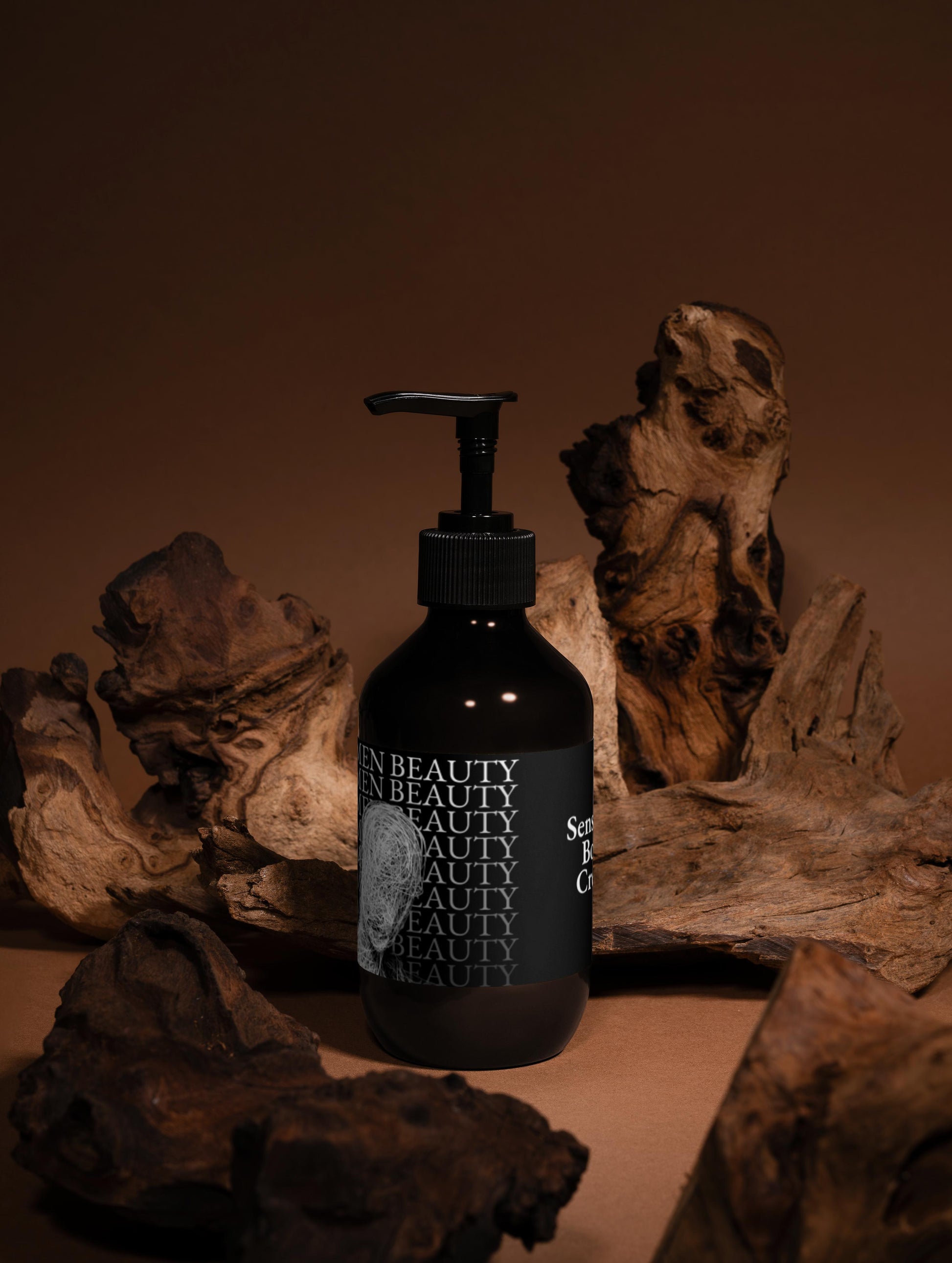 Black bottle with pump dispenser on a brown background with natural wood elements, body cream.