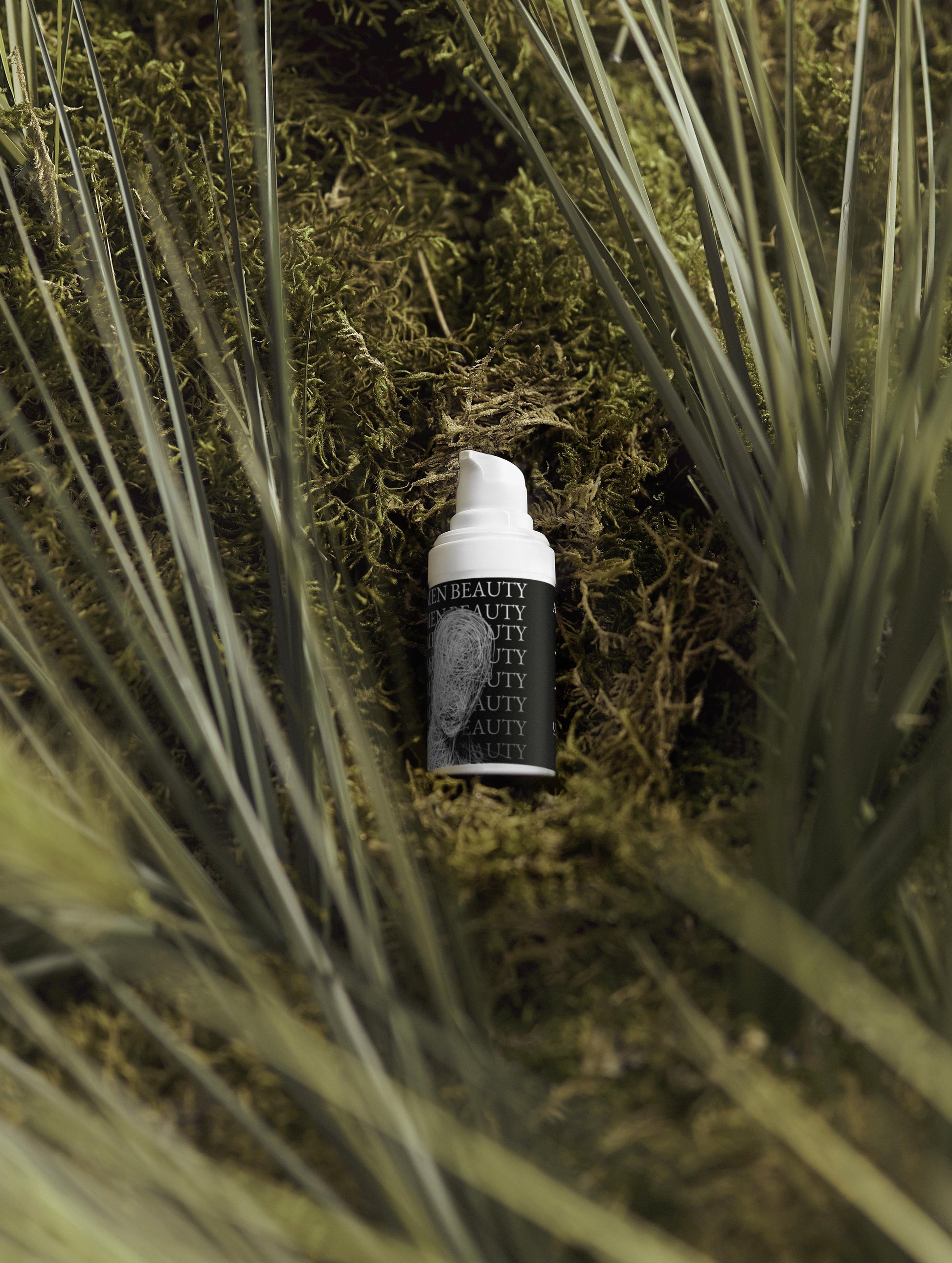 Skincare bottle with 'Men Beauty' branding on a natural background of grass and moss, Acne Spot Care.
